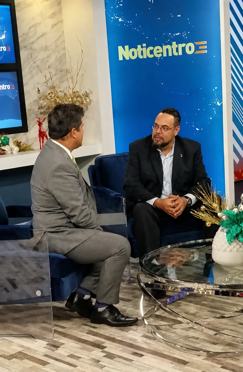 Wilfredo being interviewed on the set of the television news programme Noticentro